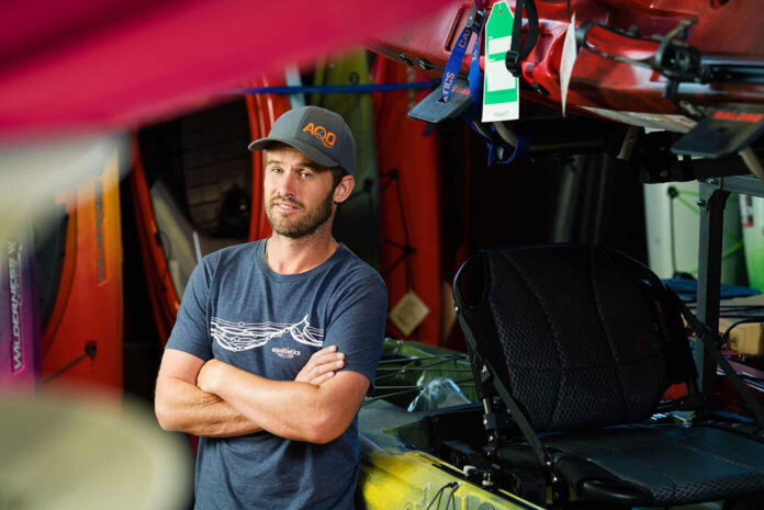 Simon Coward, owner of Aquabatics, poses in his store
