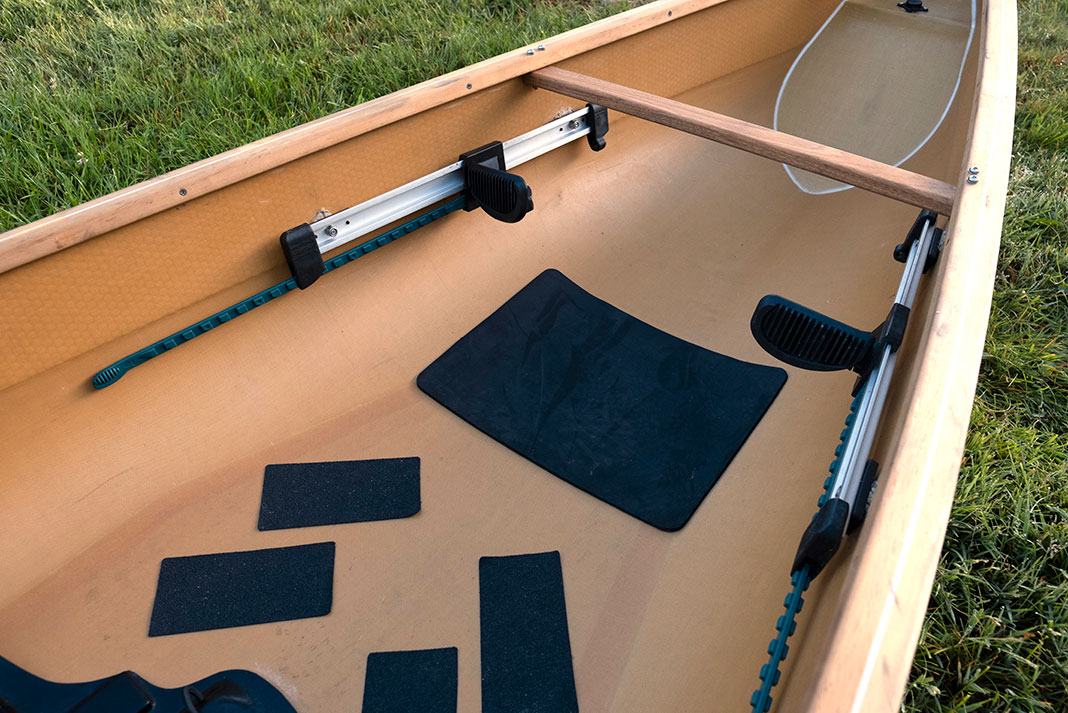 black foam pads line the wooden interior of the Stellar Dragonfly canoe