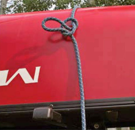 Step 2 of a canoe tie-down with the trucker's hitch knotf the trucker's hitch knot