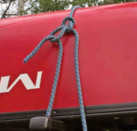 Step 3 of a canoe tie-down with the trucker's hitch knot