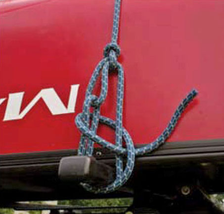 Step 4 of a canoe tie-down with the trucker's hitch knot