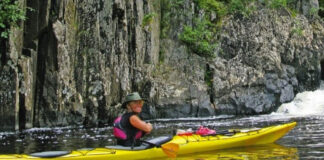 Woman paddling the Wilderness Systems Tempest 165 expedition kayak