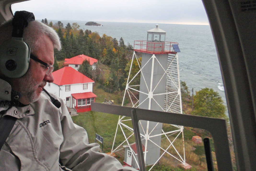 Canadian Lighthouses of Lake Superior chair Paul Capon wings over the restored Porphyry Point light station