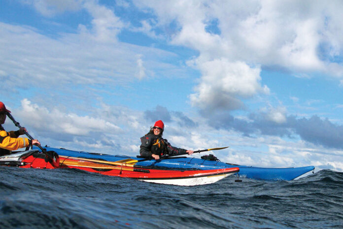 two people sea kayaking during the Gathering Storm meeting in Georgian Bay