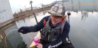 Hauling in a sturgeon on a Barbie fishing rod