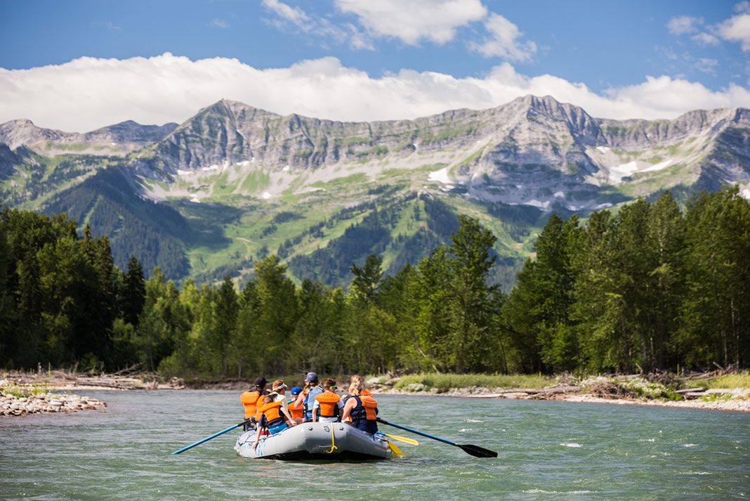 A group of rafters take in the stunning scenery on a float trip from Canyon Raft Company near Fernie