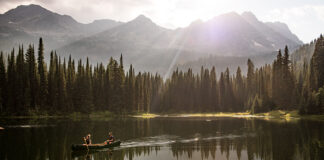 two people canoe on Island Lake near Fernie, BC