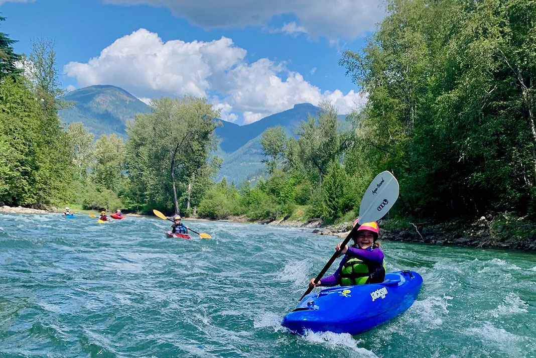 family goes whitewater kayaking on the Slocan River