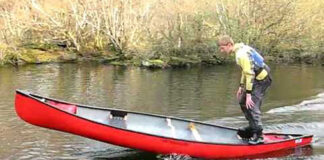 still of a young man gunwale bobbing on a red canoe from YouTube