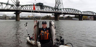 pro angler Jeff Anderson holds up his first catches from spring fishing