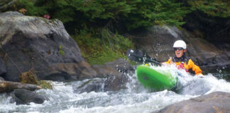 kayak fisherman tries whitewater paddling