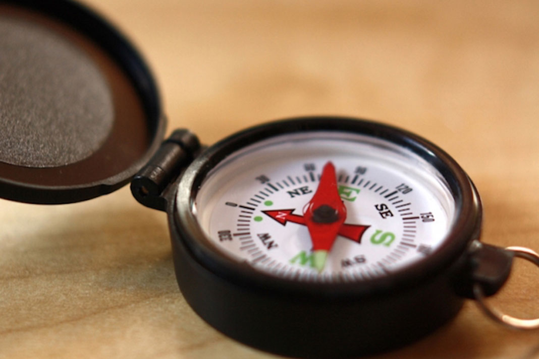 close-up photo of a hiking compass