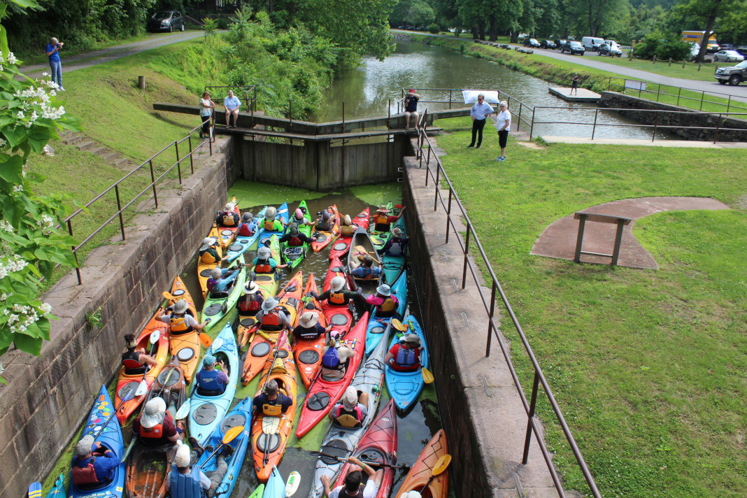 Group of paddlers passing through a canal lock on the Schuylkill River.