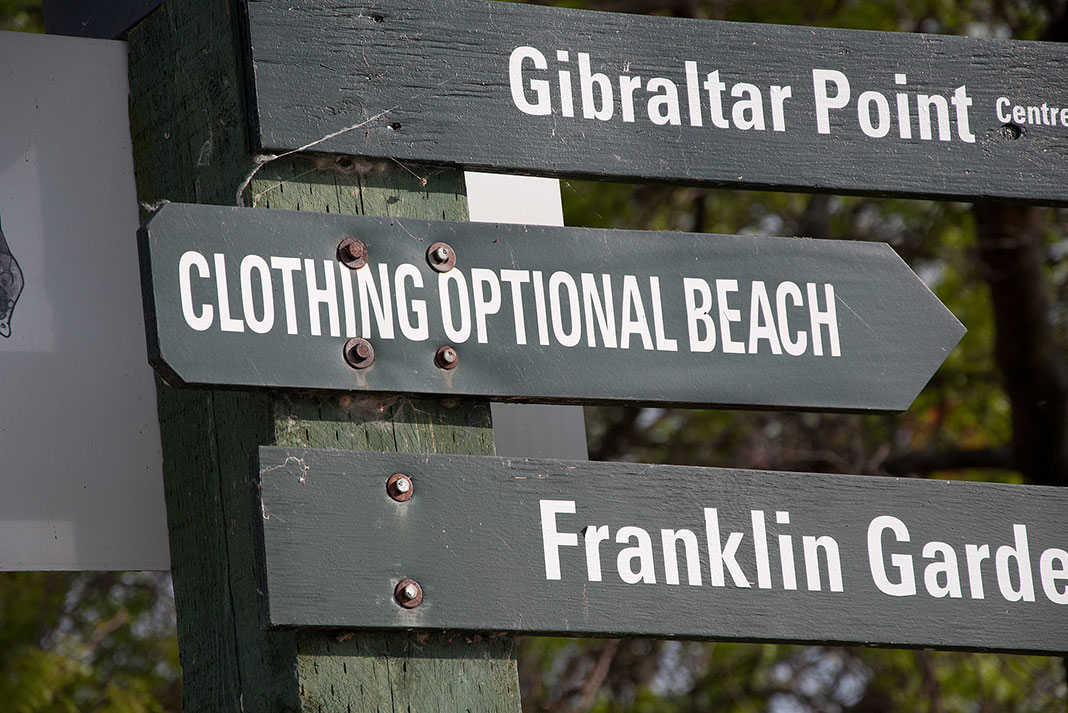 signs on the Toronto Islands pointing out Hanlan's Point clothing optional beach