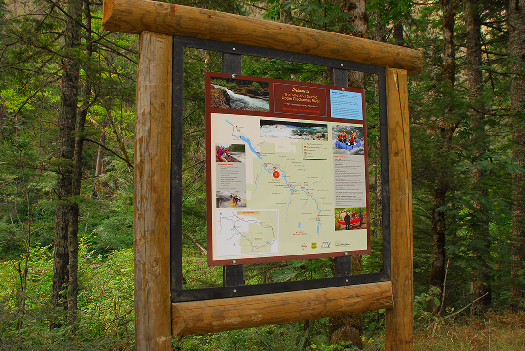 Trail map sign at a trailhead.