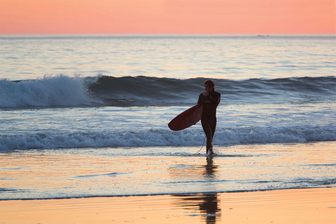 surfing at sunset on remote Vancouver Island