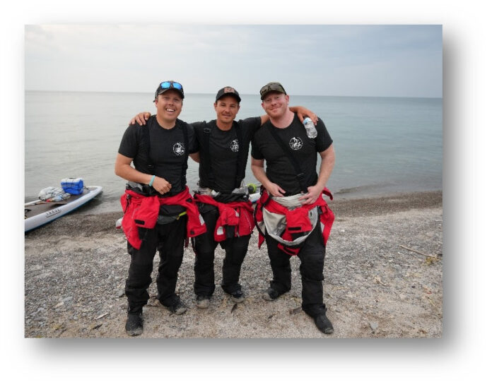 Jeff Guy, Kwin Morris and Joe Lorenz on the shores of Lake Ontario by Fort Niagara after 35 mile 13 hour paddle from Toronto on Friday June 9, 2023