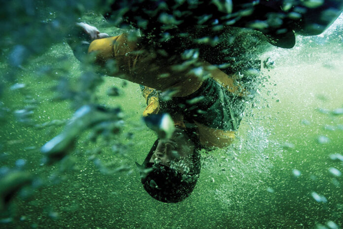 kayaker upside doing a kayak roll
