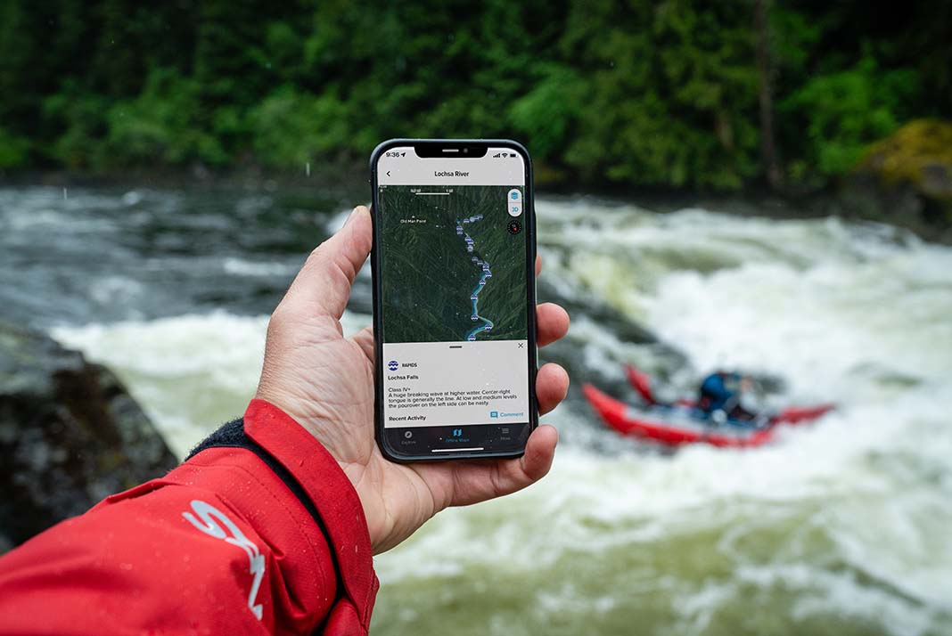 Person holding phone displaying PaddleWays app.