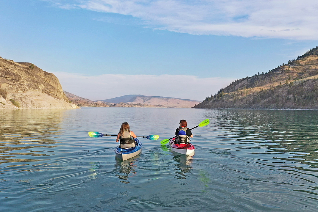 two people paddling Eddyline brand kayaks