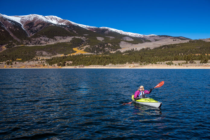 woman paddles a lightweight kayak from Advanced Elements