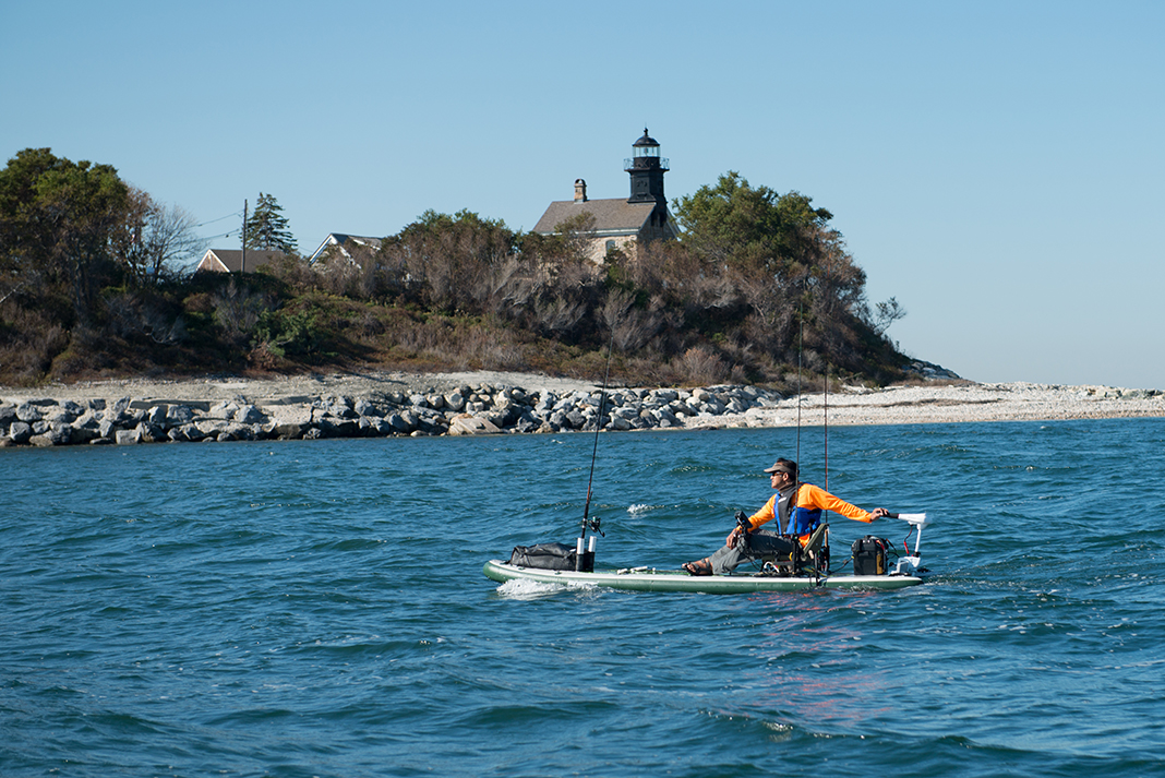 man uses a motorized paddleboard from Sea Eagle