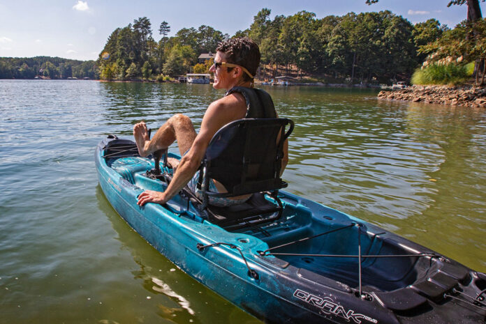 man pedals a pedal kayak from Perception