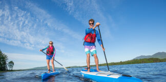 two people standup paddling on touring paddleboards from Sea Eagle