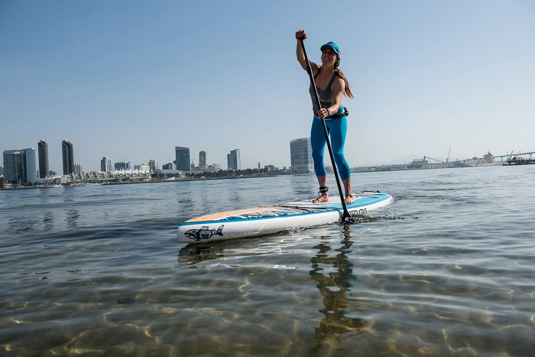 woman paddles a standup paddleboard from Boardworks