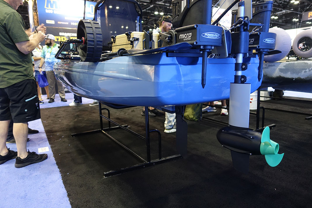 Detail of the Native Watercraft TitanX 12.5 stern with motor and stakeout poles at ICAST 2023