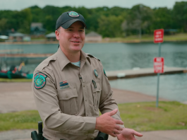 Game warden giving advice on boat ramp etiquette.