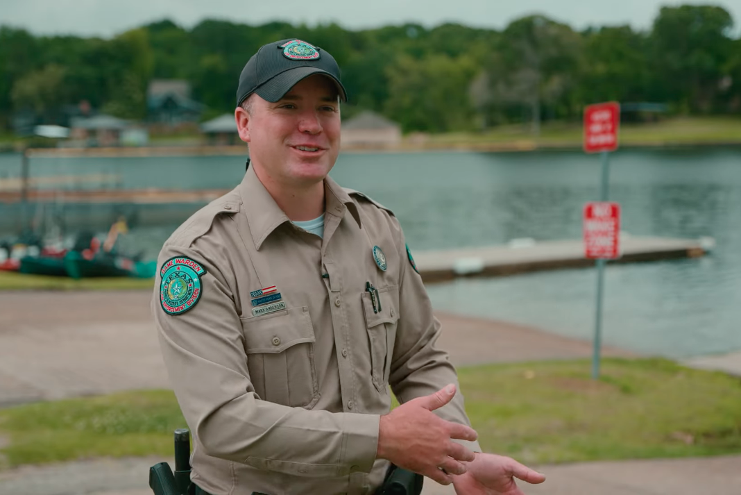 Game warden giving advice on boat ramp etiquette.