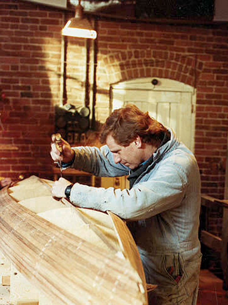 Brian Henry of Current Designs in Victoria works on a new cedar strip plug