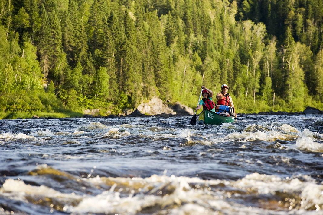 two people paddle through rapids on the Missinaibi River