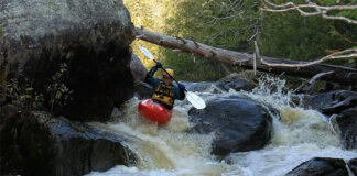 Man whitewater kayaking on Skunk Creek