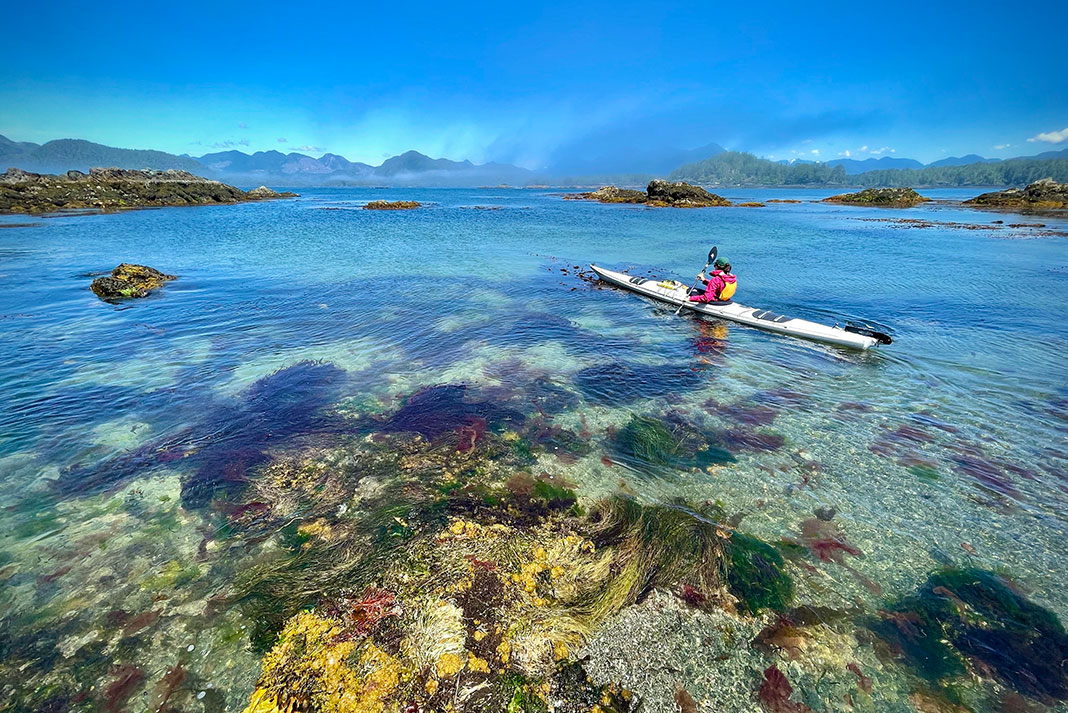 a person sea kayaking through the intertidal zone on a cool, crisp day