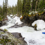 3 Expert Tips For Conquering Scary Rapids a whitewater paddler looks downriver during the spring runoff before running the scary rapids