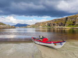 a sea kayak sits on the Scottish coast during an expedition