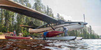 People load canoes onto a float plane used by Wabakimi Outfitters