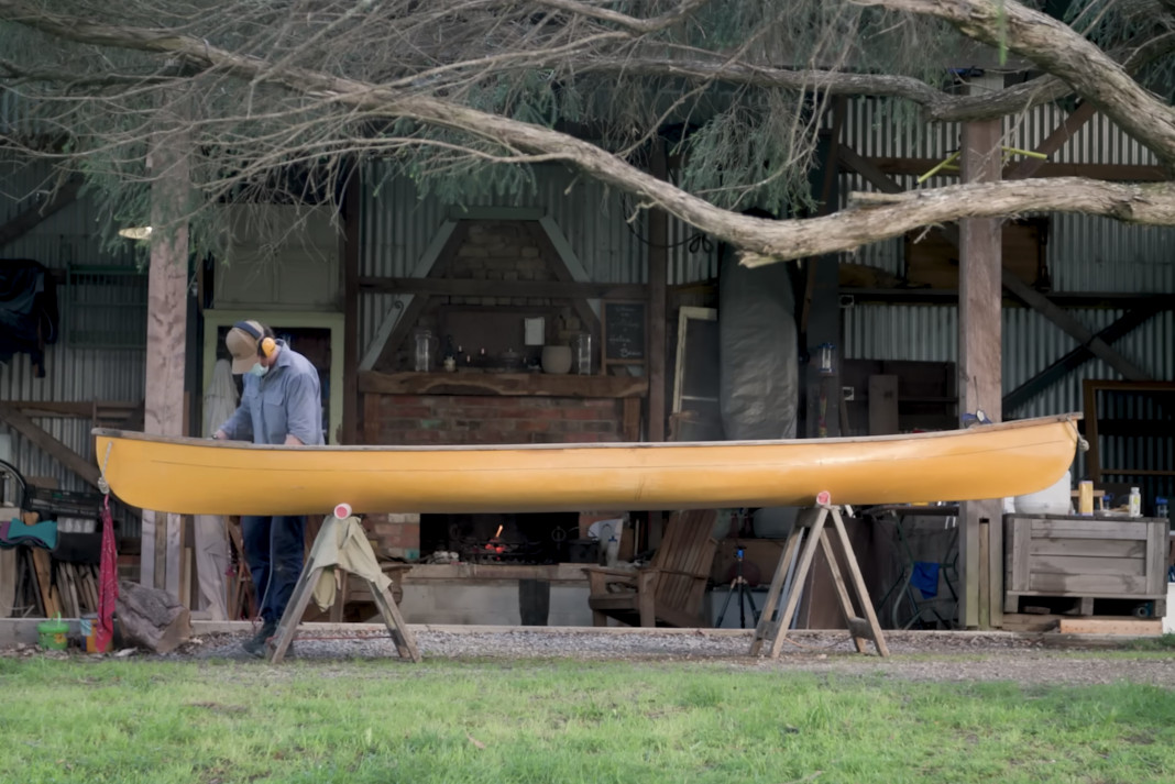 Beau Miles renovating a canoe while running a marathon