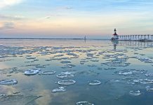 icy water on Lake Michigan in front of a lighthouse, where you can catch coho salmon