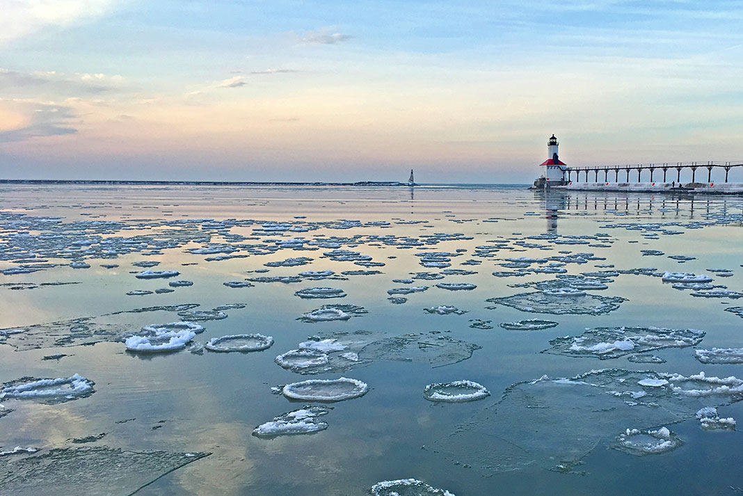 icy water on Lake Michigan in front of a lighthouse, where you can catch coho salmon