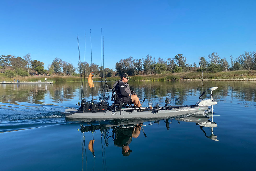 man fishes from a kayak with a trolling motor installed