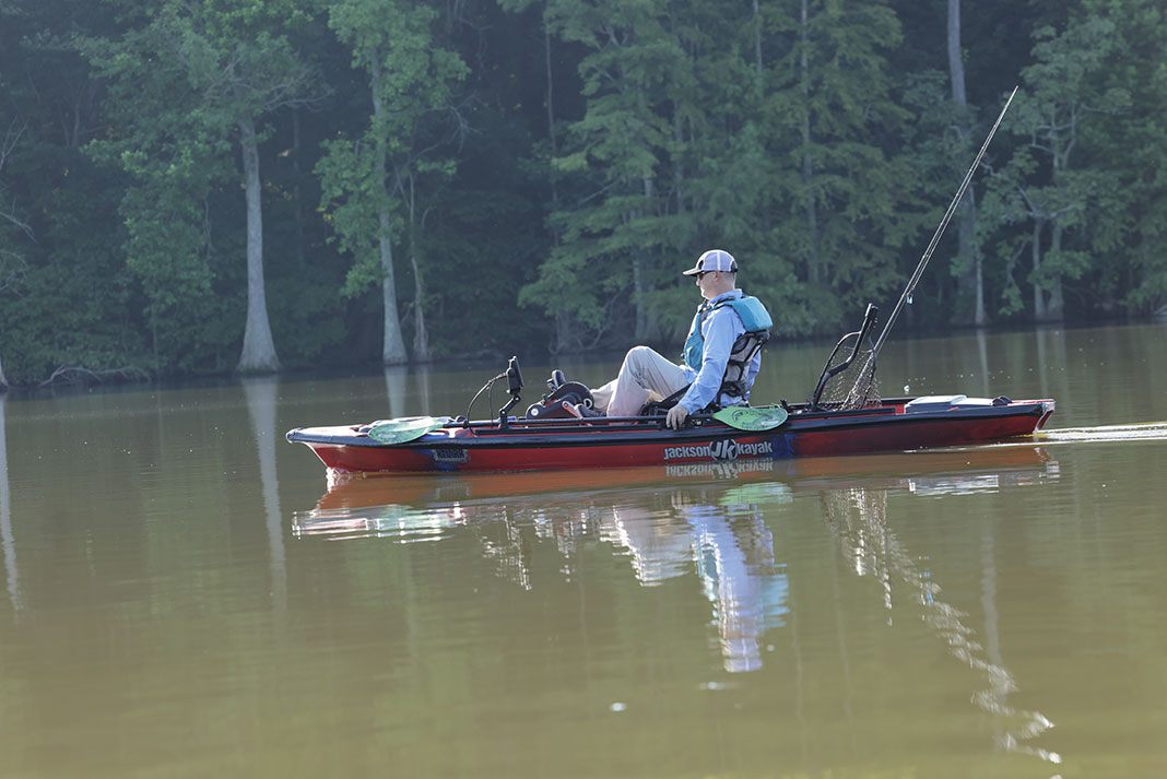 man sits and pedals the Jackson Knarr FD 2023 fishing kayak