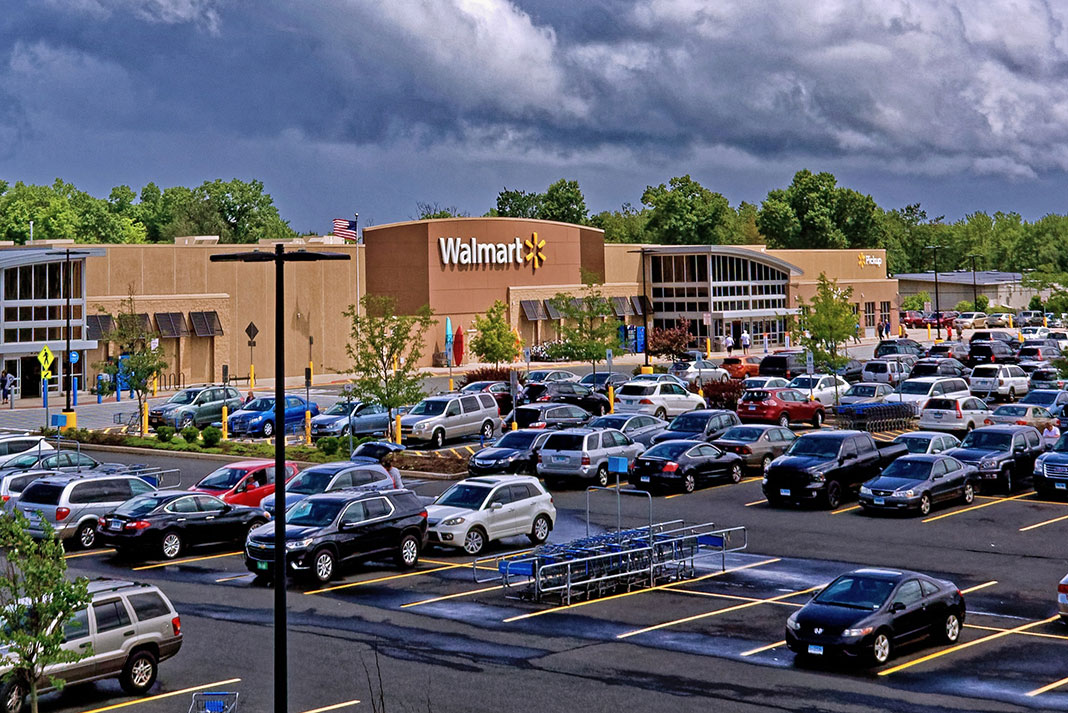 exterior of a Walmart store and parking lot where they sell fishing kayaks