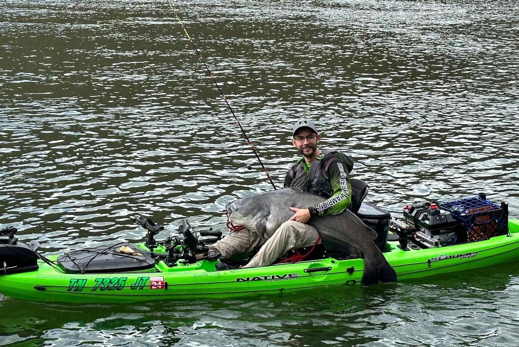 Angler Daniel Leake with 85-pound catfish caught on Tennessee River.
