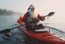 santa paddling a kayak