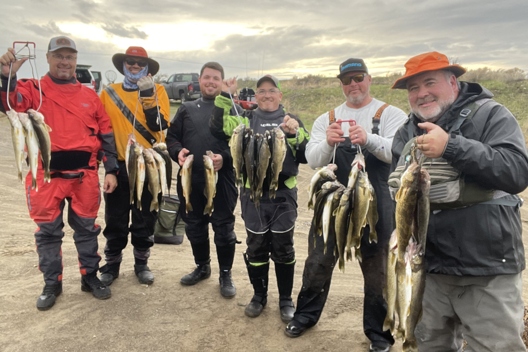 Anglers showing off walleye catch.