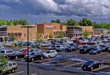 exterior of a Walmart store and parking lot where they sell fishing kayaks