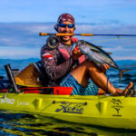 Expert Tips On Fishing For Yellowfin Tuna man poses with yellowfin tuna caught by kayak off Panama